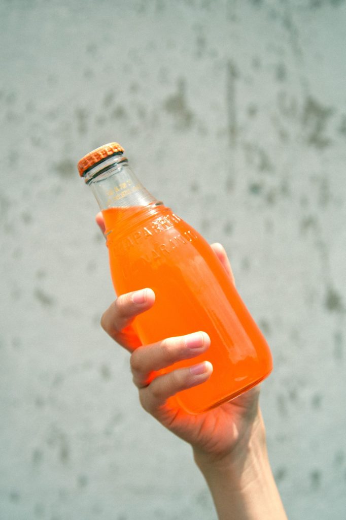 hand holding a soda for effects of caffeine on the body